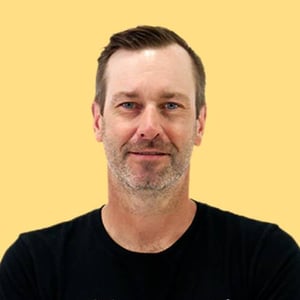 Tim-Glomb-Yellow-Headshot