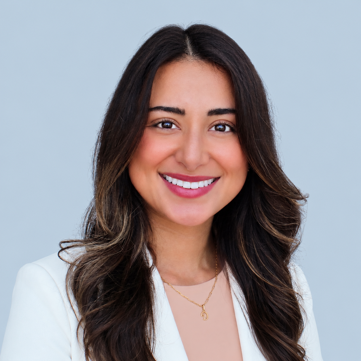 Professional Headshot on a Pale Blue Background
